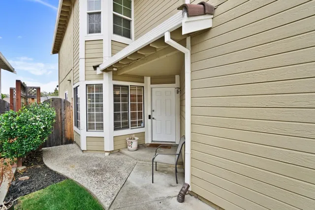 a view of entrance gate of a house with a window