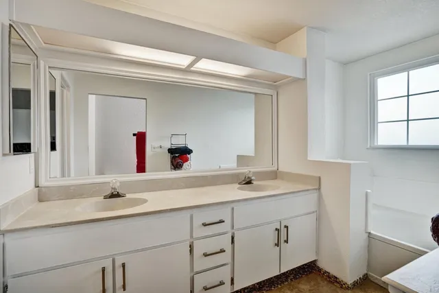 a bathroom with a sink and a mirror