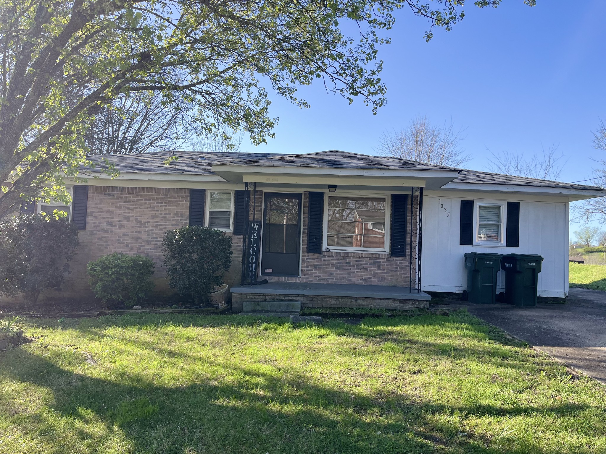 1035 North 3rd Street Pulaski, TN 38478 - Photo 1 of 14 a front view of a house with a yard