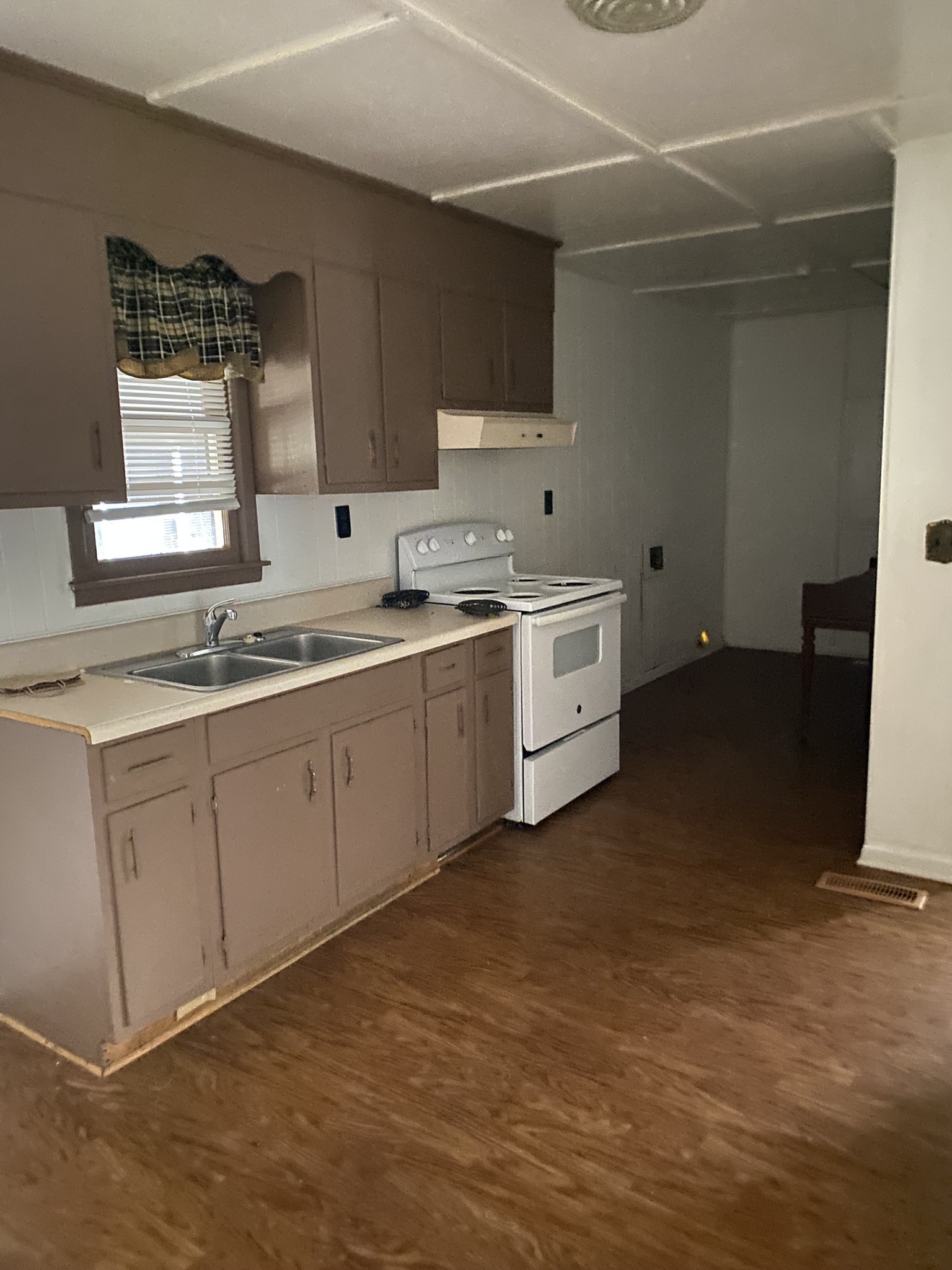1035 North 3rd Street Pulaski, TN 38478 - Photo 9 of 14 a kitchen with a sink cabinets and appliances