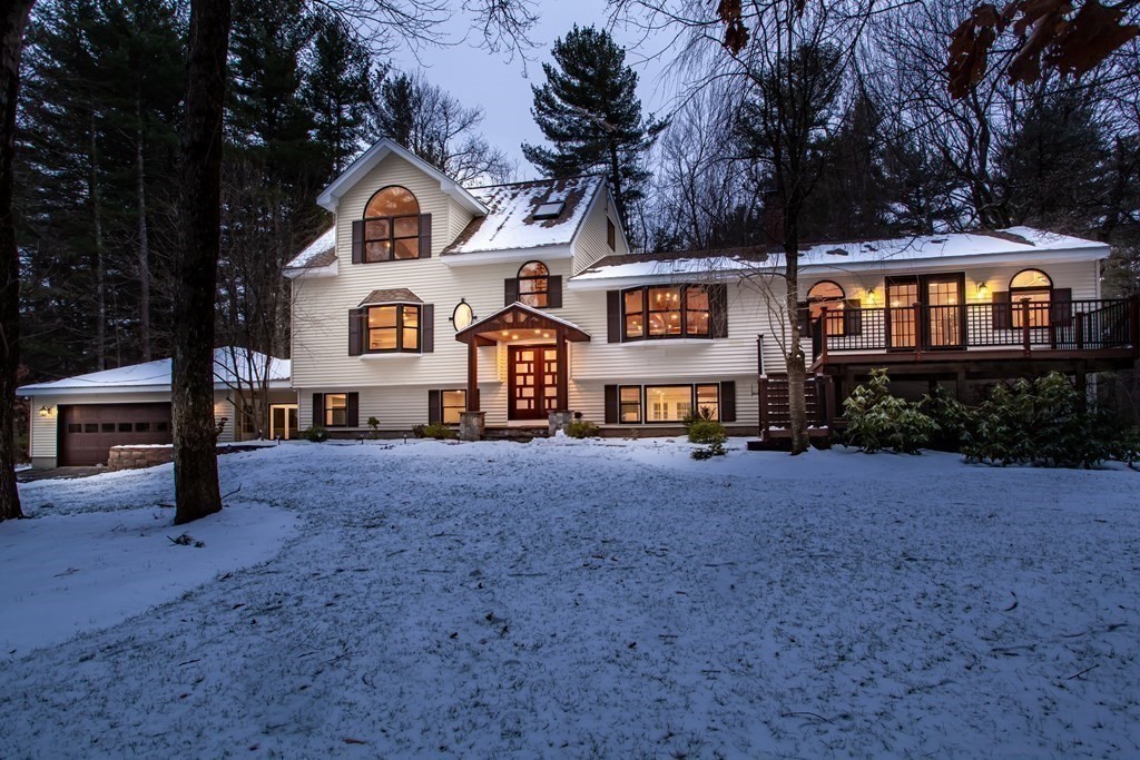 14 Pikes Hill Road Sterling, MA 01564 - Photo 1 of 40 a front view of a house with a yard and garage