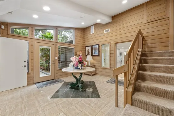 a kitchen with stainless steel appliances granite countertop a stove a sink dishwasher and a refrigerator