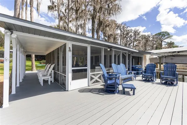 a front view of house with yard swimming pool and patio