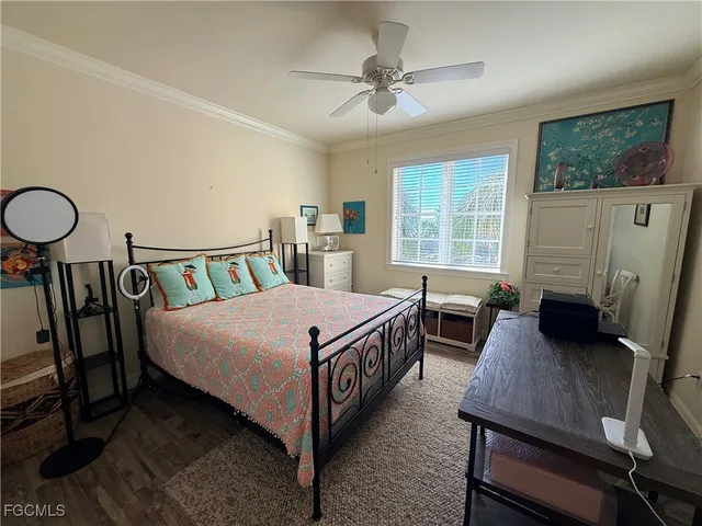 a bedroom with a bed and a desk