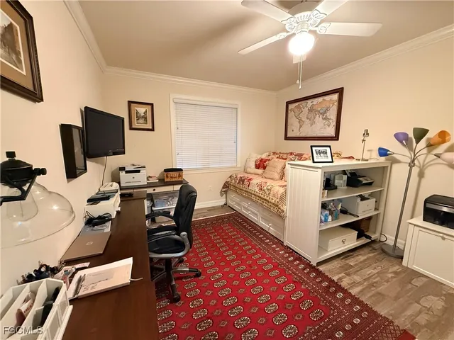 a bed room with a bed and a television