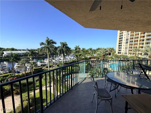 a view of a swimming pool and outside seating area