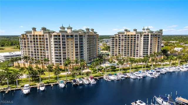 a living room with lots of furniture and kitchen view