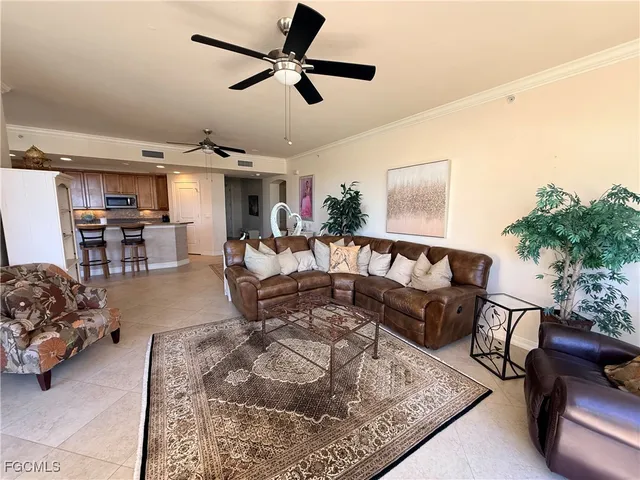 a bedroom with furniture and a chandelier