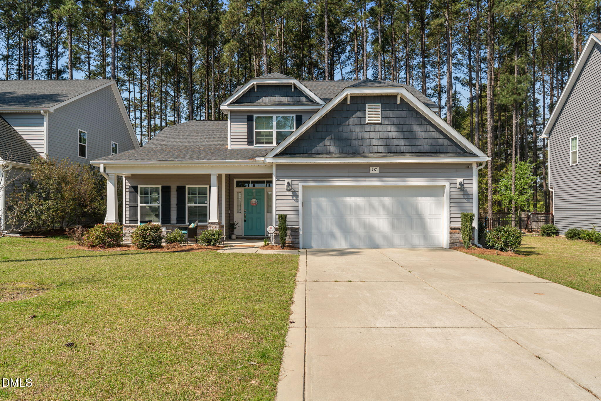 157 Timber Skip Drive Spring Lake, NC 28390 - Photo 1 of 44 a front view of a house with swimming pool and porch with furniture