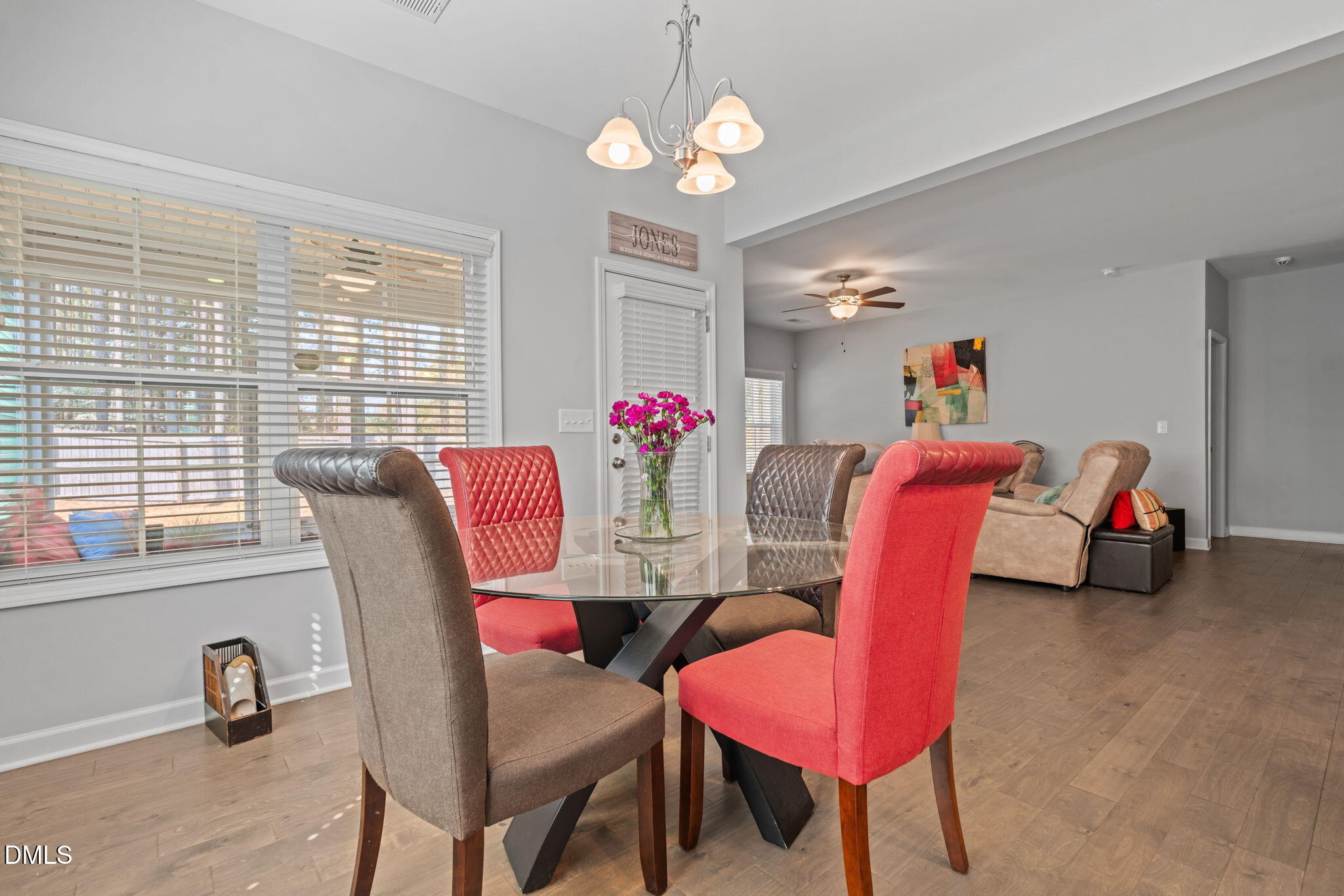 157 Timber Skip Drive Spring Lake, NC 28390 - Photo 11 of 44 a view of a dining room with furniture and a chandelier
