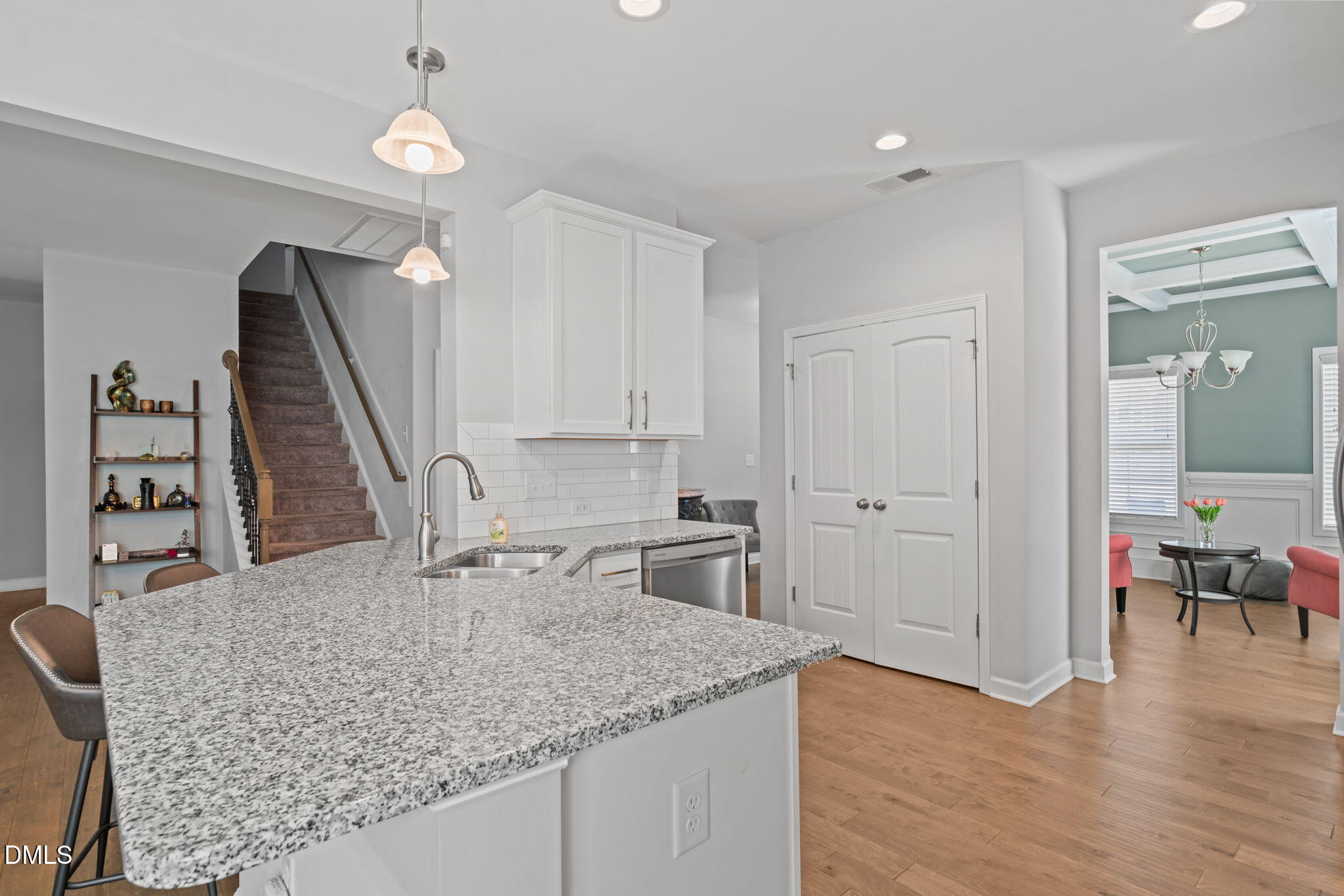 157 Timber Skip Drive Spring Lake, NC 28390 - Photo 12 of 44 a view of kitchen island stainless steel appliances sink wooden floor dining table and chair