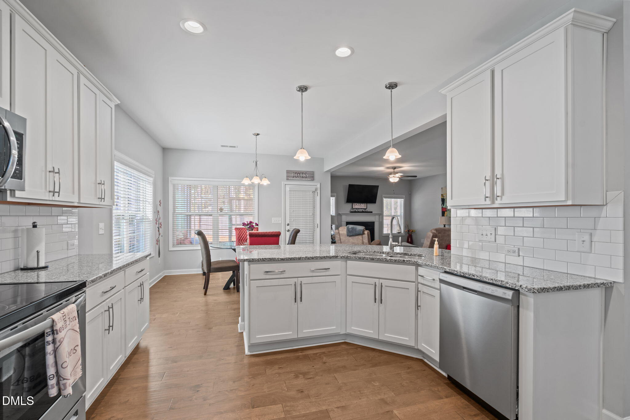 157 Timber Skip Drive Spring Lake, NC 28390 - Photo 13 of 44 a kitchen that has a lot of cabinets in it and appliances