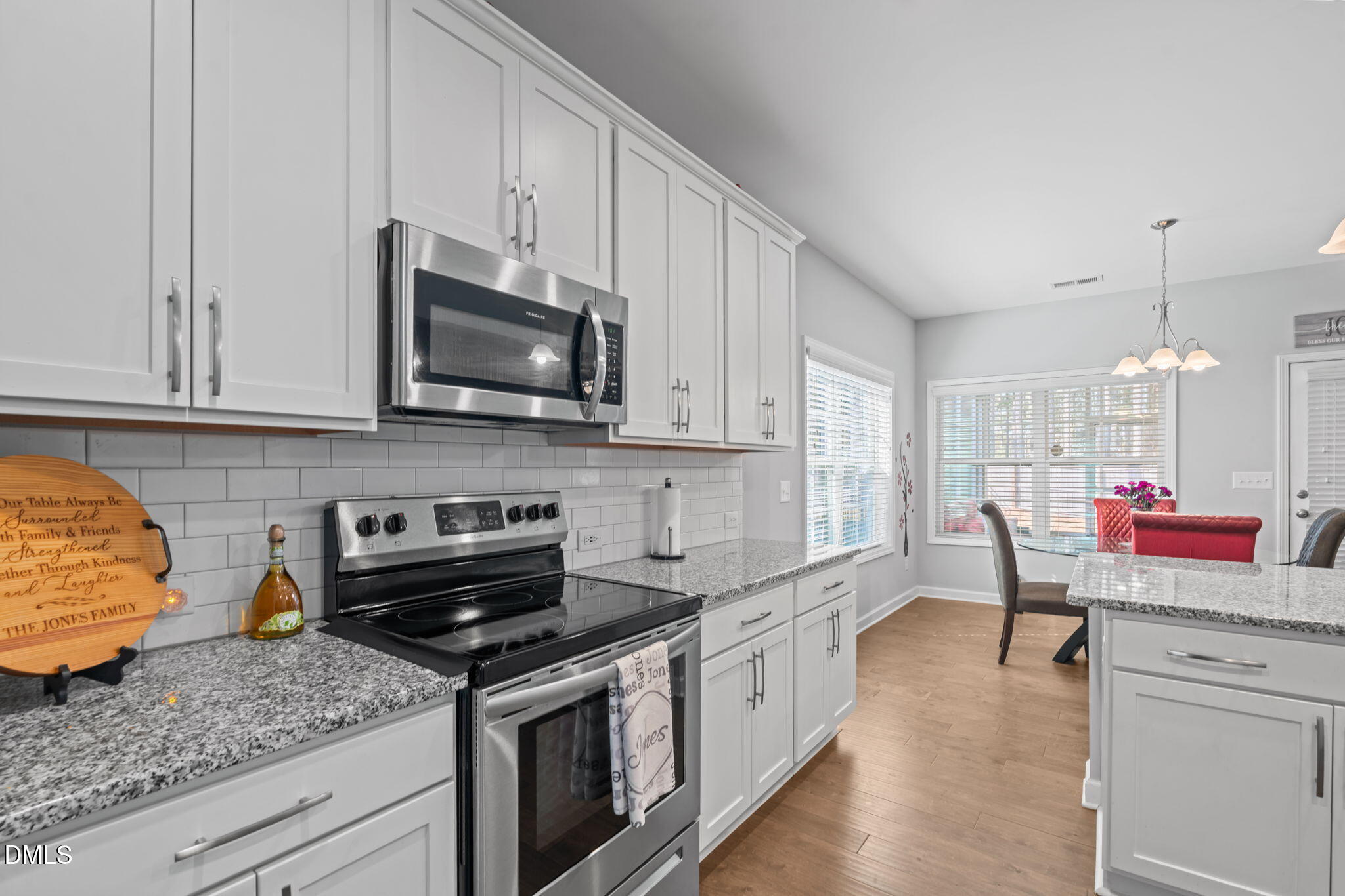 157 Timber Skip Drive Spring Lake, NC 28390 - Photo 14 of 44 a kitchen with stainless steel appliances granite countertop a stove a sink and a microwave