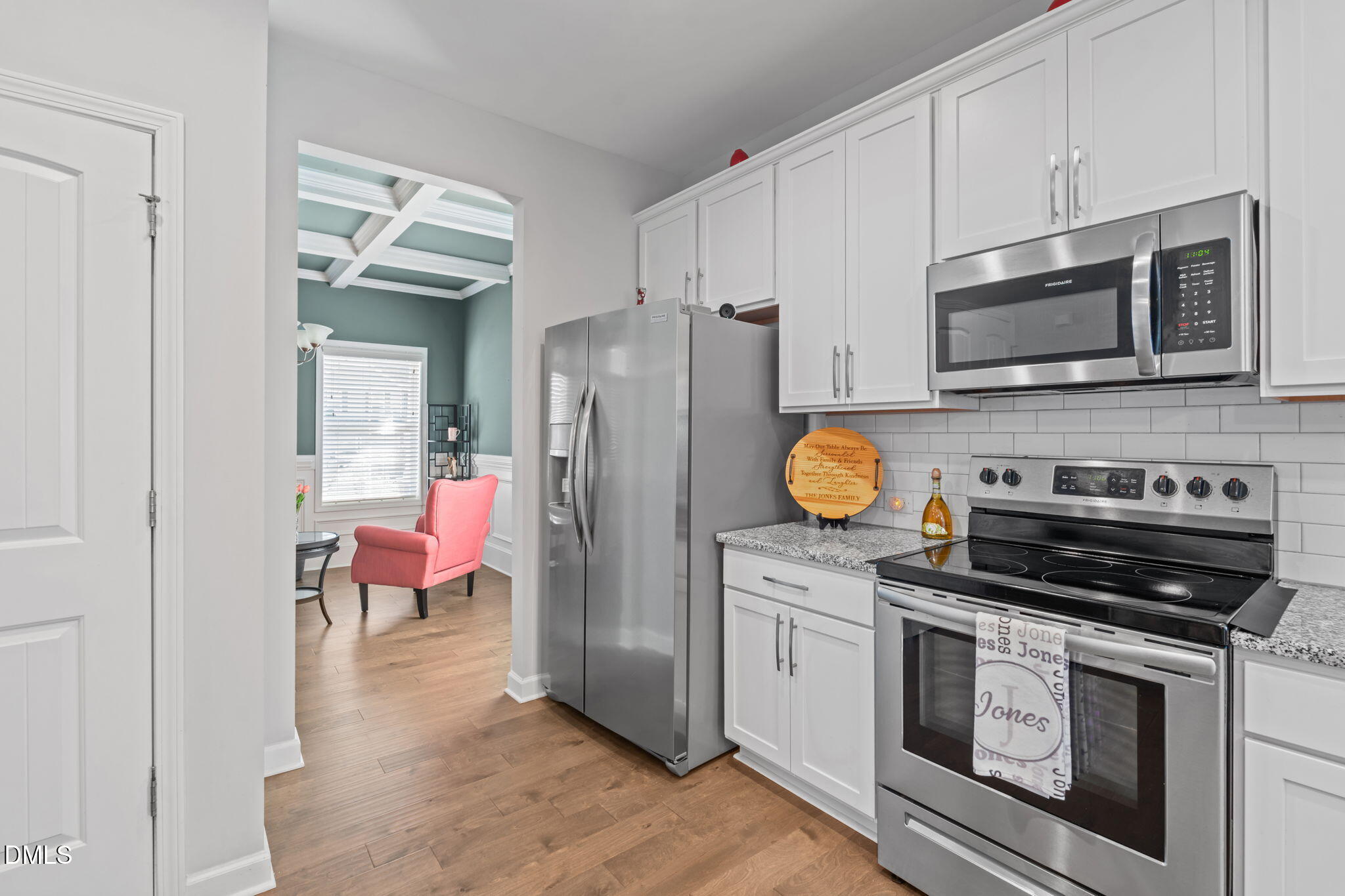 157 Timber Skip Drive Spring Lake, NC 28390 - Photo 17 of 44 a kitchen with stainless steel appliances a stove microwave and cabinets