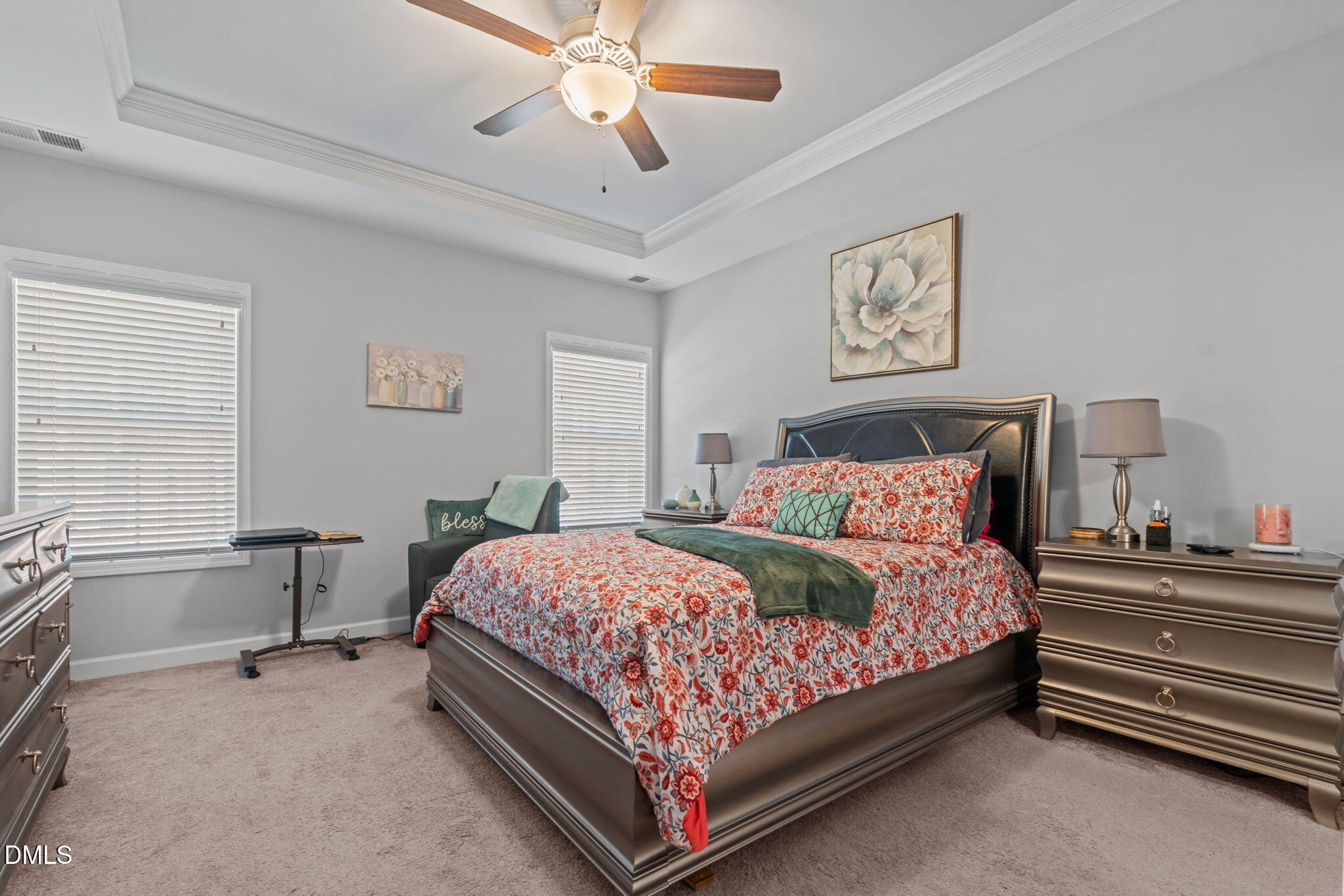 157 Timber Skip Drive Spring Lake, NC 28390 - Photo 19 of 44 a bedroom with a bed and a chandelier