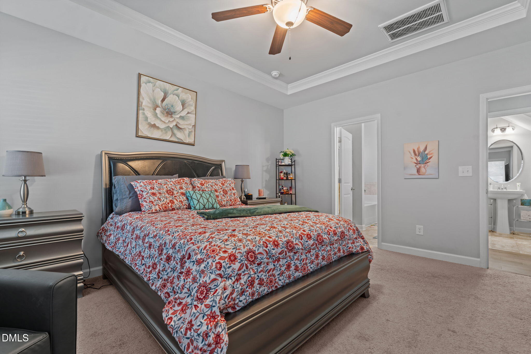 157 Timber Skip Drive Spring Lake, NC 28390 - Photo 20 of 44 a bedroom with bed and a chandelier