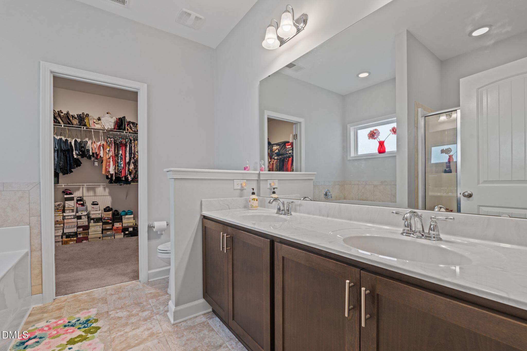 157 Timber Skip Drive Spring Lake, NC 28390 - Photo 21 of 44 a bathroom with a sink double vanity and a mirror