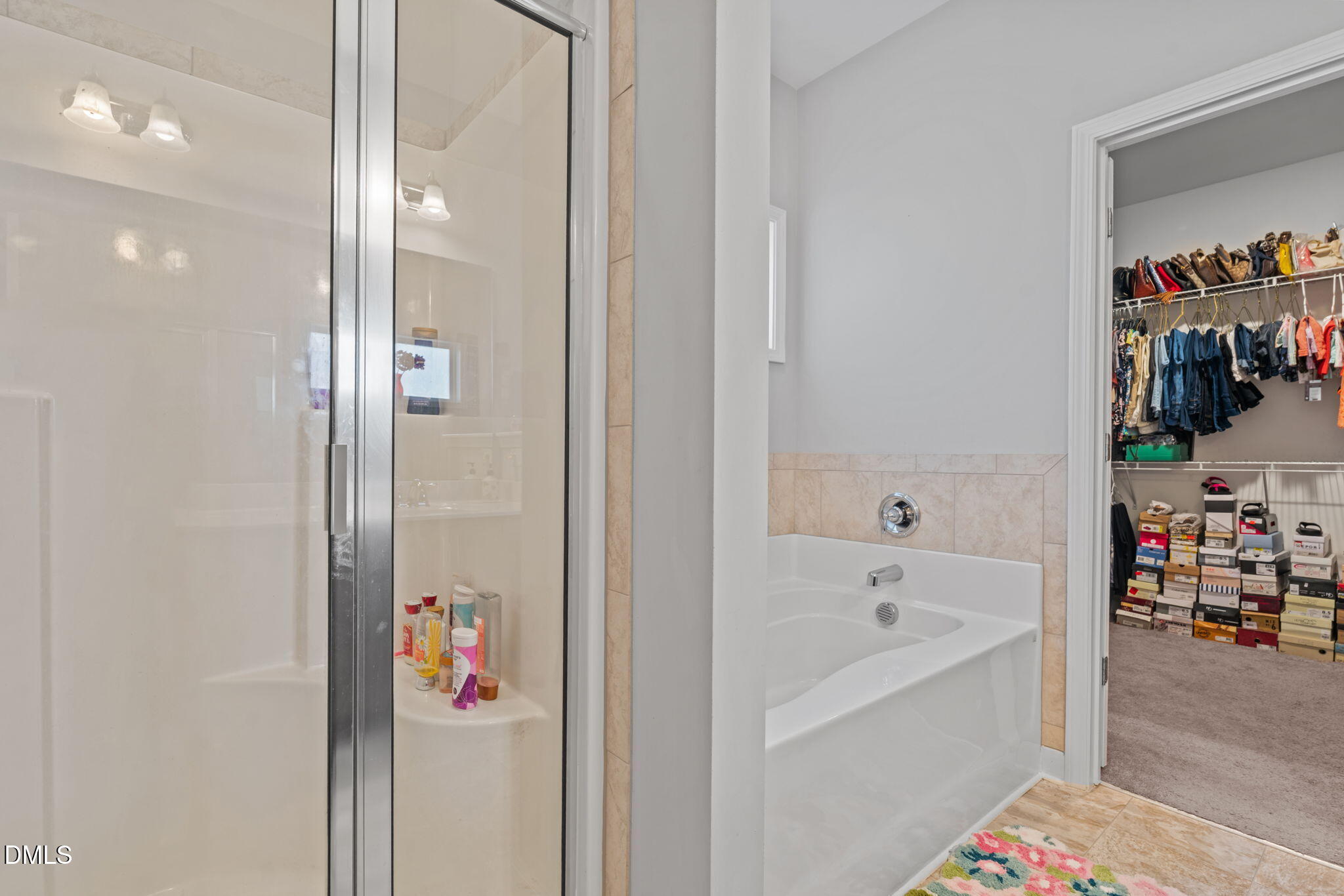 157 Timber Skip Drive Spring Lake, NC 28390 - Photo 22 of 44 a bathroom with a bathtub and a shower