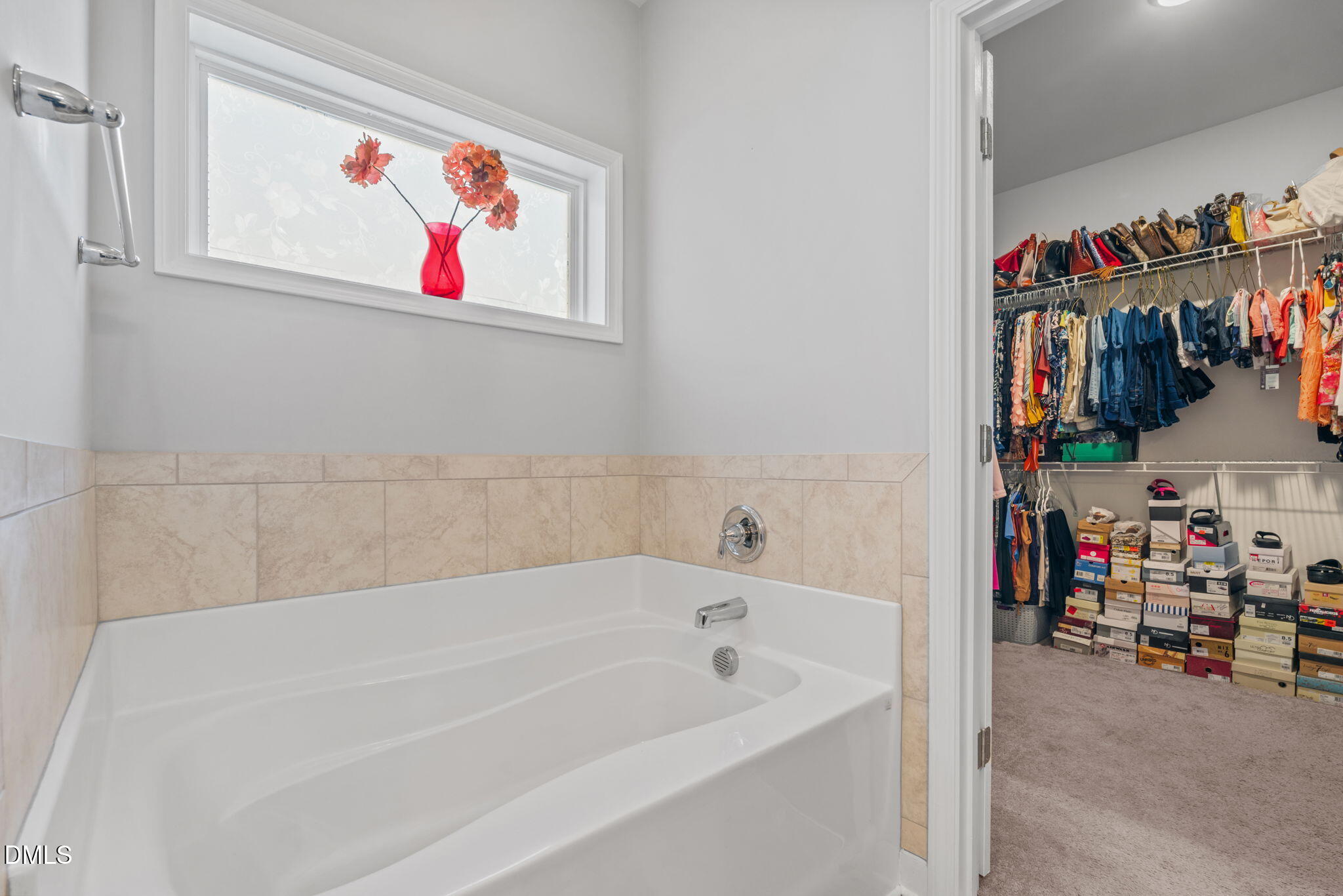 157 Timber Skip Drive Spring Lake, NC 28390 - Photo 23 of 44 a bath tub sitting next to a white cabinet