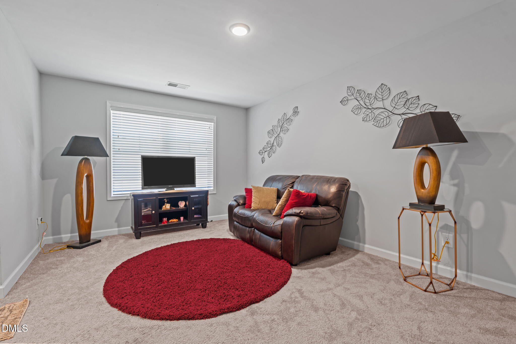 157 Timber Skip Drive Spring Lake, NC 28390 - Photo 25 of 44 a living room with furniture and a flat screen tv