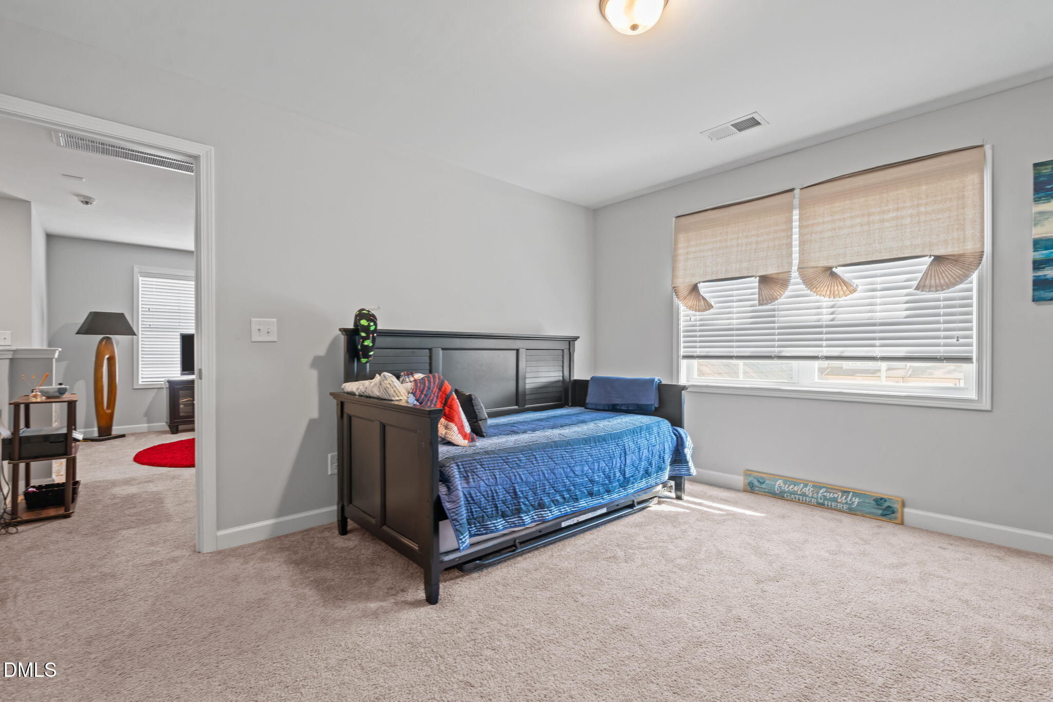 157 Timber Skip Drive Spring Lake, NC 28390 - Photo 27 of 44 a bedroom with a bed and a window