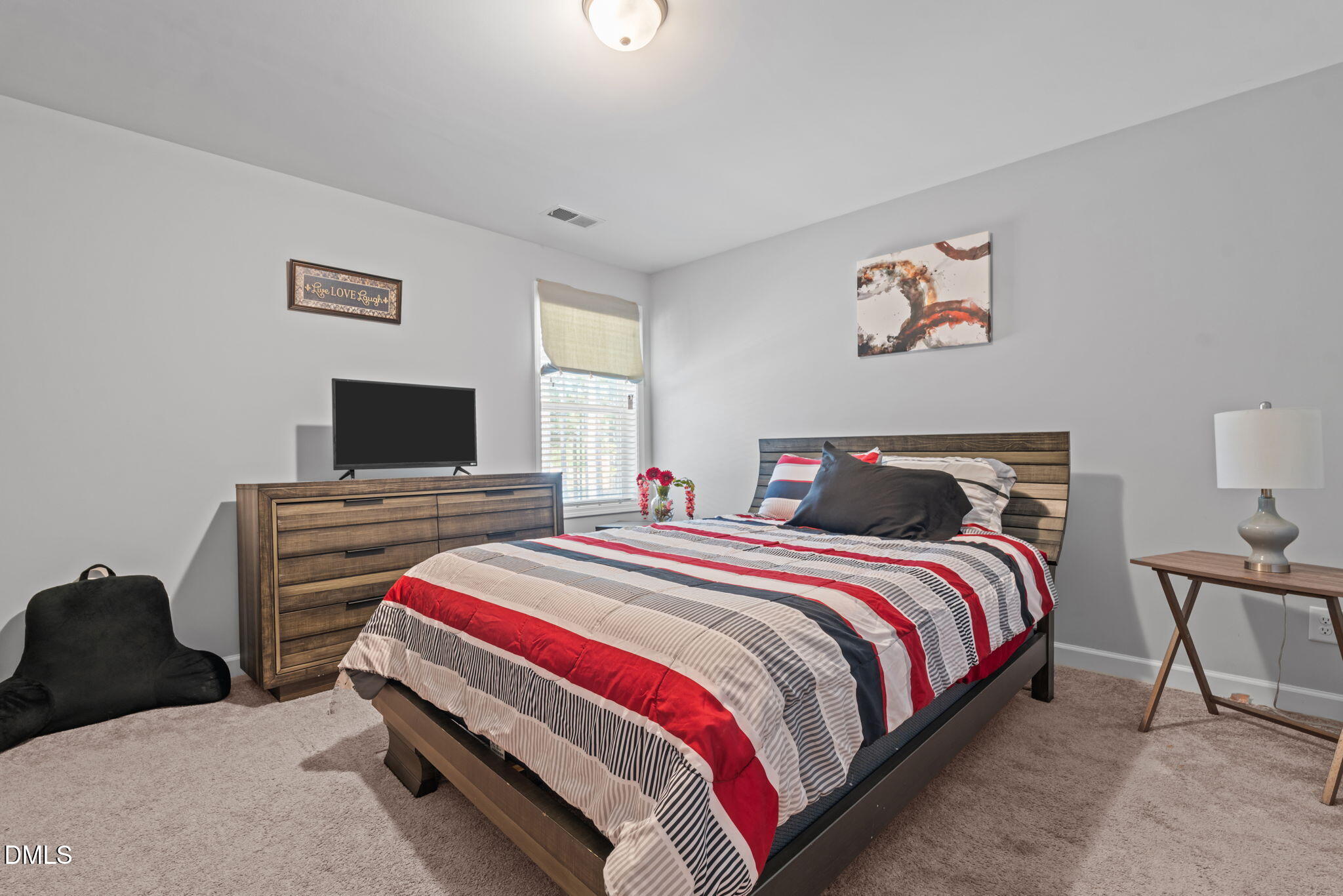 157 Timber Skip Drive Spring Lake, NC 28390 - Photo 28 of 44 a bedroom with a bed and a television