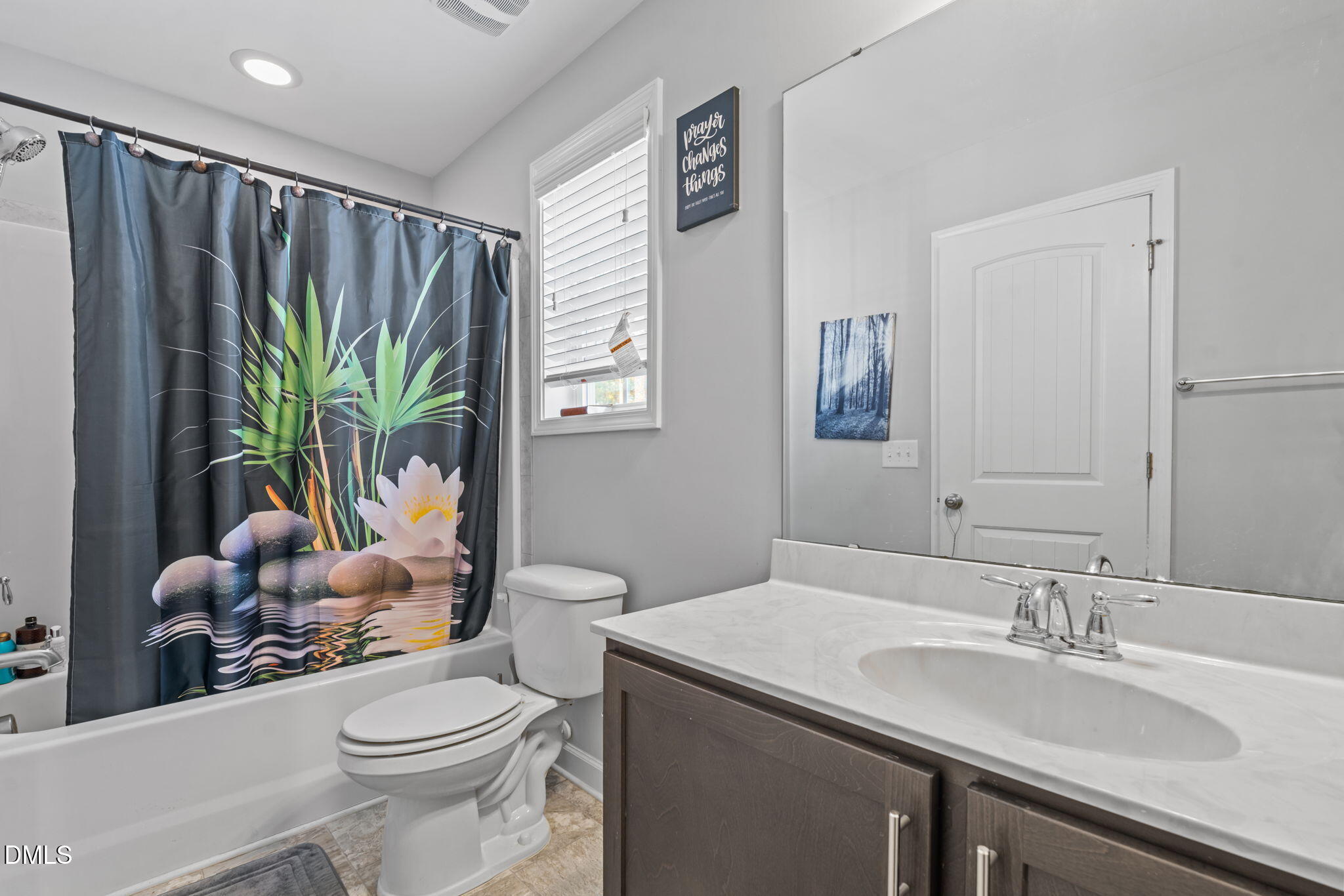 157 Timber Skip Drive Spring Lake, NC 28390 - Photo 29 of 44 a bathroom with a granite countertop sink a toilet and a mirror