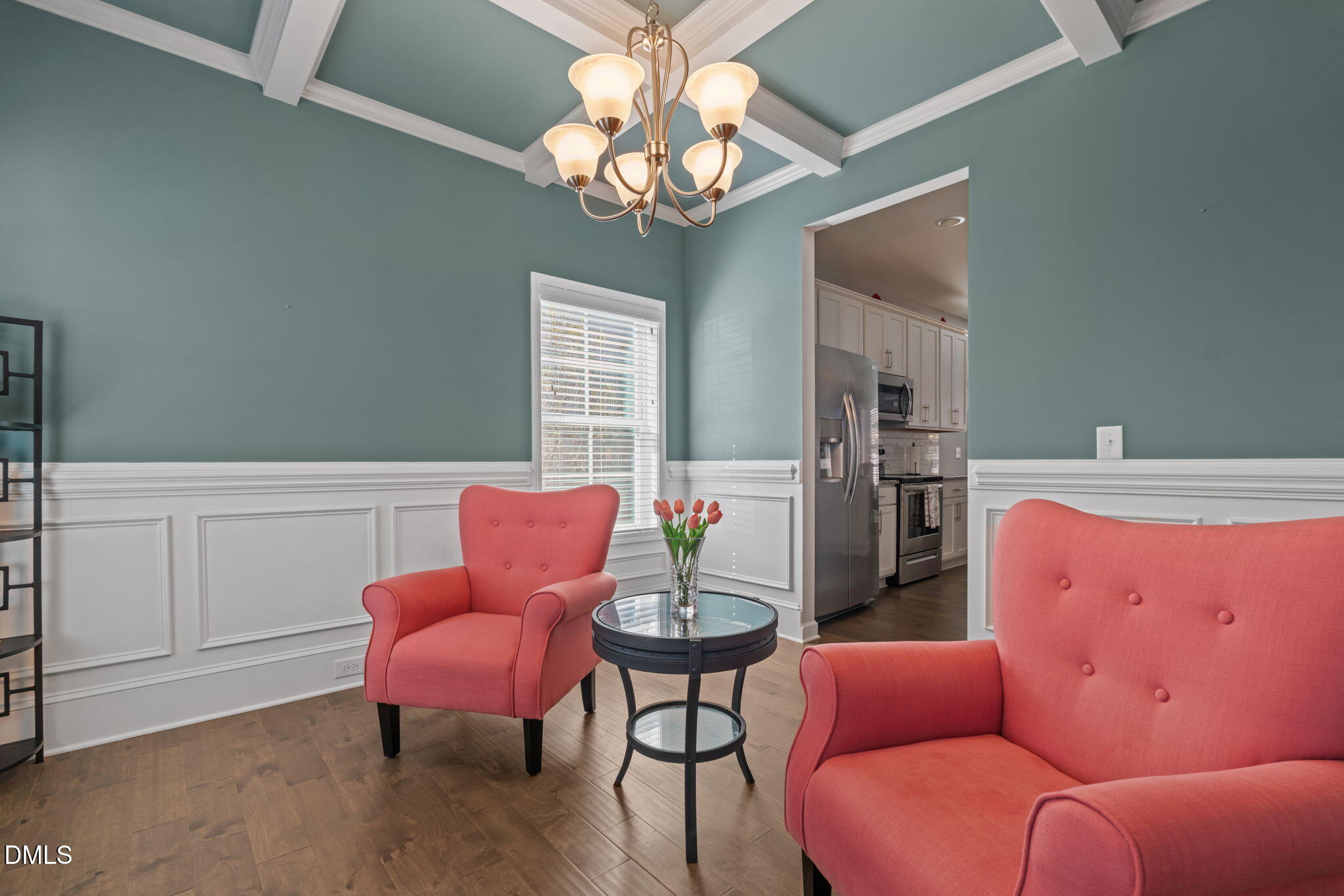 157 Timber Skip Drive Spring Lake, NC 28390 - Photo 4 of 44 a living room with furniture a chandelier and a window
