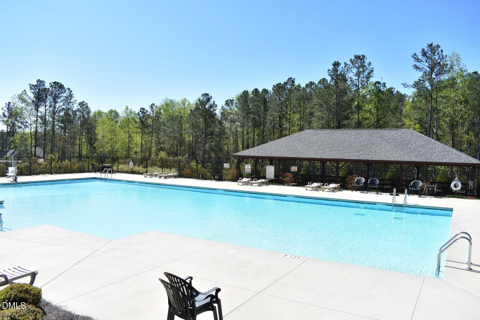 157 Timber Skip Drive Spring Lake, NC 28390 - Photo 44 of 44 a view of a swimming pool and lounge chairs