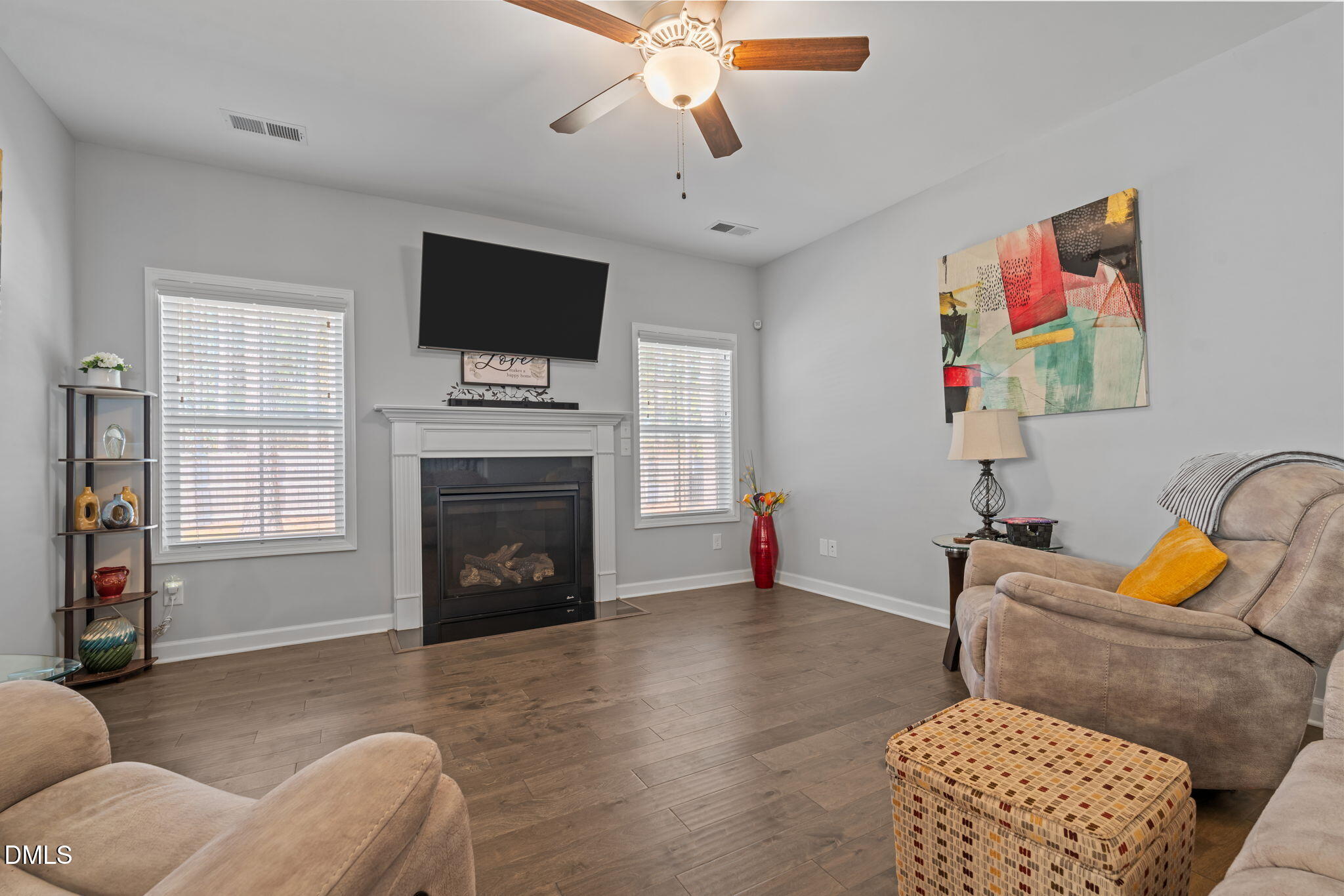 157 Timber Skip Drive Spring Lake, NC 28390 - Photo 8 of 44 a living room with furniture fireplace and flat screen tv