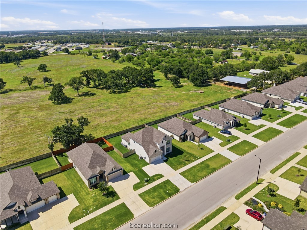 1922 Viva Road Bryan, TX 77807 - Photo 40 of 45 Stunning aerial perspective showcasing rare privacy with no rear neighbors and ranch views behind the home.