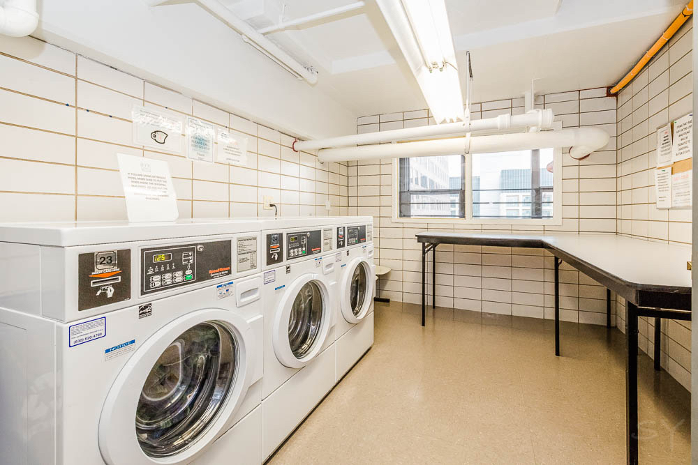 777 North Michigan Avenue, Unit 1307 Chicago, IL 60611 - Photo 15 of 17 a utility room with dryer and washer