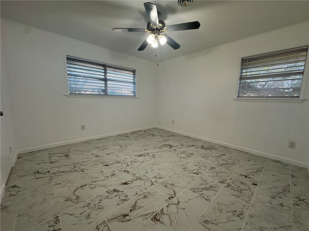 136 Daniel Moore Avenue Portland, TX 78374 - Photo 15 of 40 a view of a ceiling fan in a room