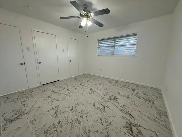 a view of a livingroom with a ceiling fan