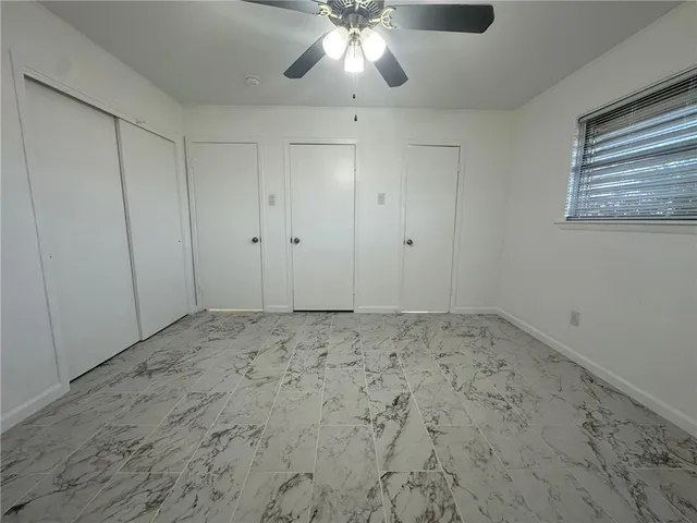 a view of a big room with carpet