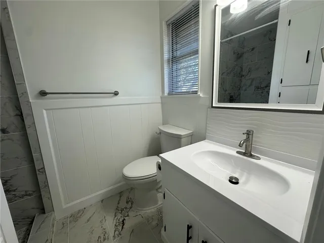 a view of empty room with ceiling fan