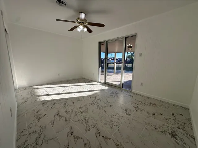 an empty room with fan