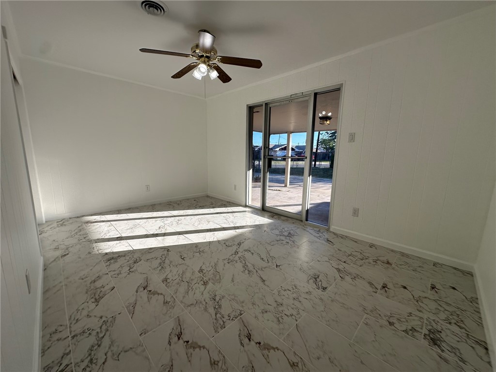 136 Daniel Moore Avenue Portland, TX 78374 - Photo 25 of 40 a view of empty room with ceiling fan