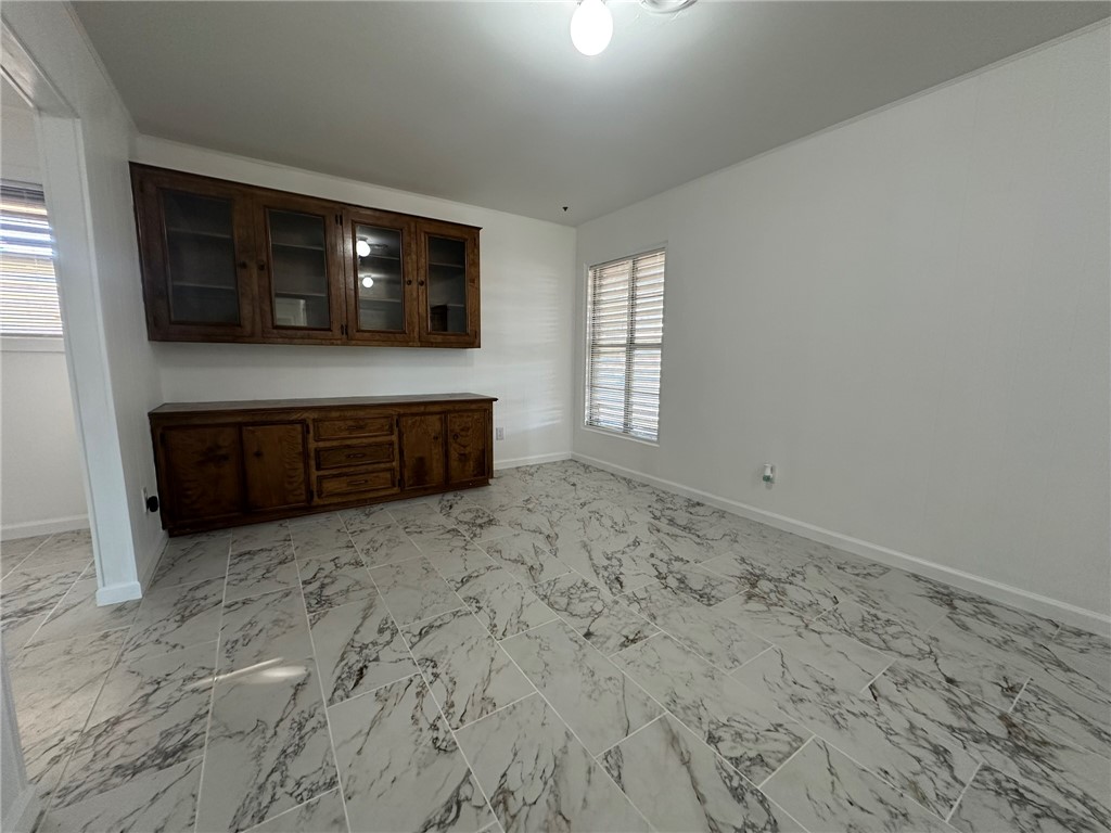 136 Daniel Moore Avenue Portland, TX 78374 - Photo 3 of 40 a living room with a large window and a flat screen tv