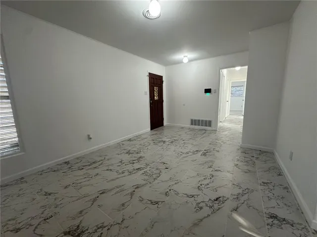 a view of a livingroom with wooden floor