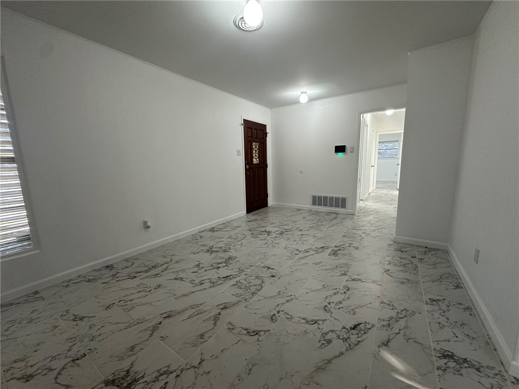 136 Daniel Moore Avenue Portland, TX 78374 - Photo 4 of 40 a view of a livingroom with wooden floor