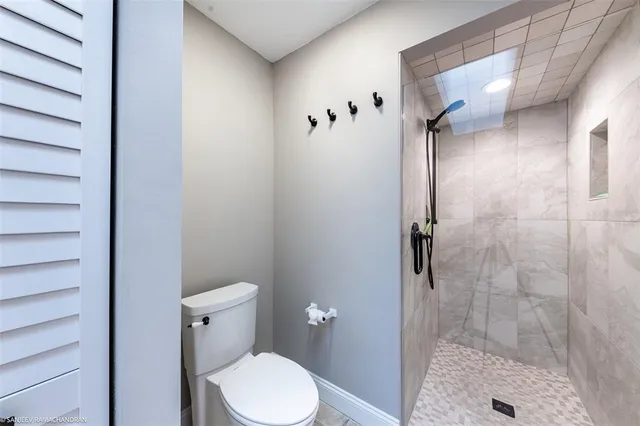 a bedroom with a bed dresser and a window