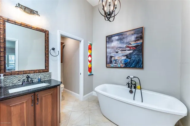 a living room with furniture a window and a dining table