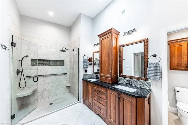 a kitchen with granite countertop a sink and a stove