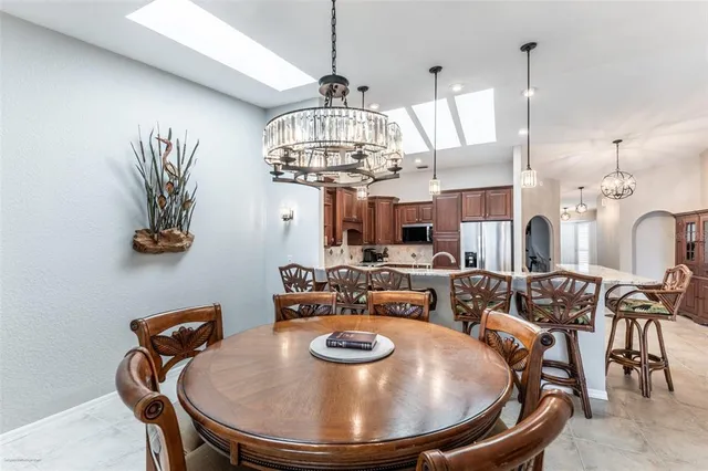 a view of a swimming pool with an outdoor seating