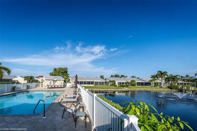 a living room with furniture a window and a flat screen tv