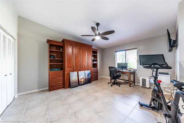a kitchen with granite countertop cabinets stainless steel appliances and a counter space