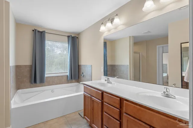 a bathroom with a bathtub and a sink