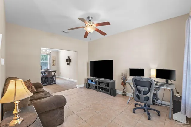 a view of a livingroom with workspace and a couch