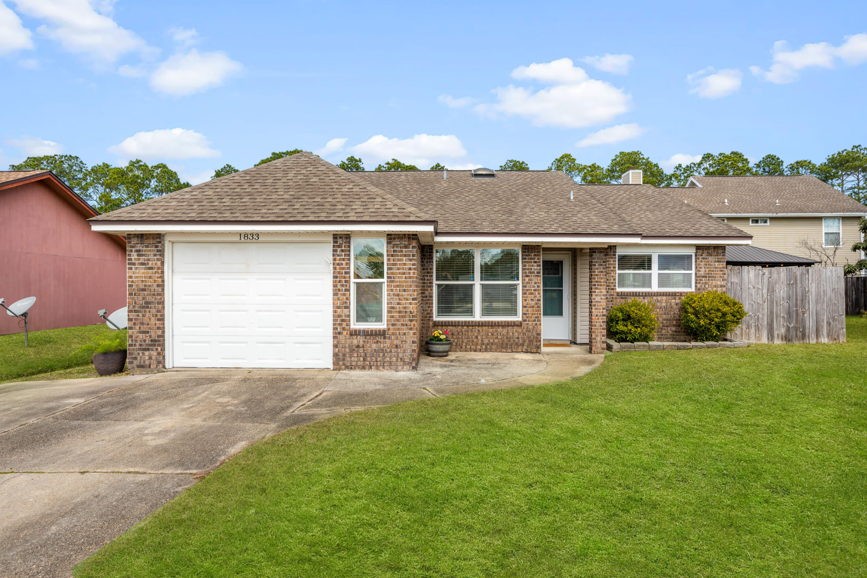 front view of a house with a yard
